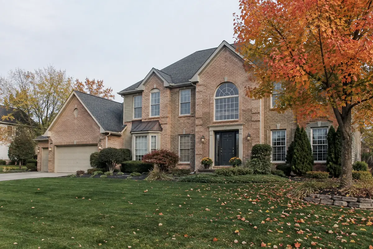 Brick home with autumn maple in Marble Cliff, Ohio