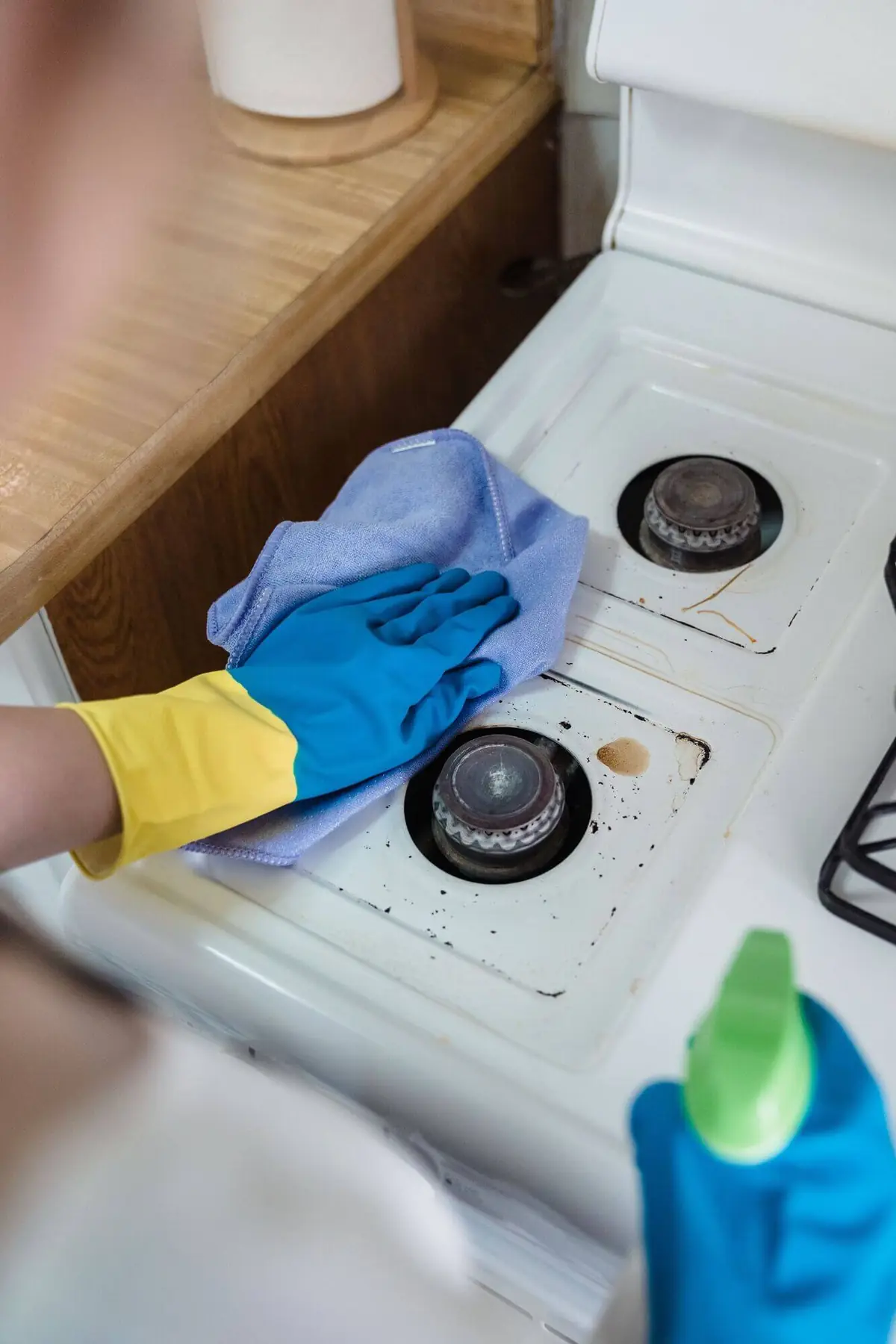 Wiping down a stovetop in Delaware, OH